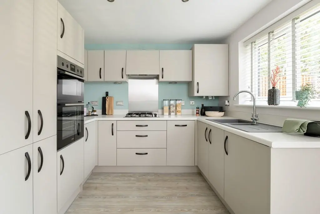 The kitchen is well set out with ample storage
