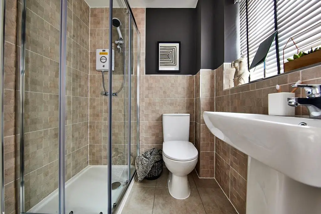 Finished with a modern en suite shower room
