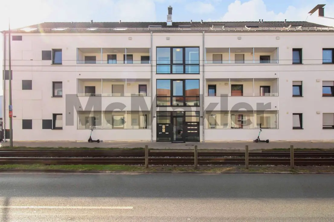 Frontansicht -- Ihr neues Zuhause in Bielefeld: 3-Zi.-Whg. mit Terrasse und TG-Platz in gepflegtem KfW70-Neubau