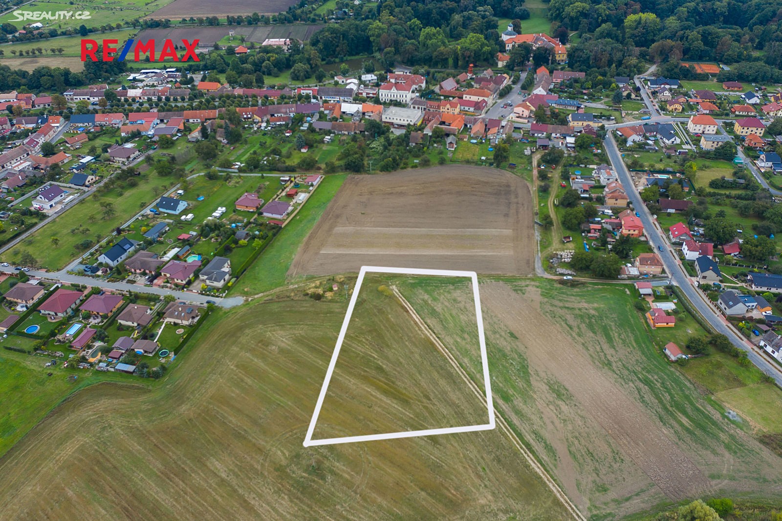 Prodej  stavebního pozemku 5 768 m², Severní, Choltice