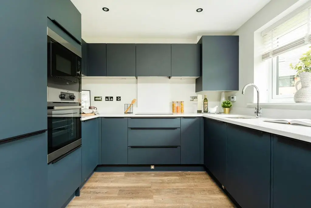 A modern kitchen with plenty of storage and...