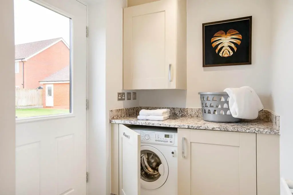 Convenient utility room is perfect for laundry...