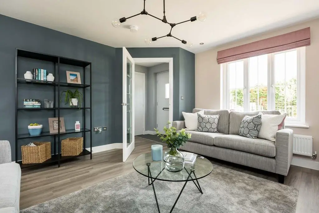 Large window floods the lounge with natural light