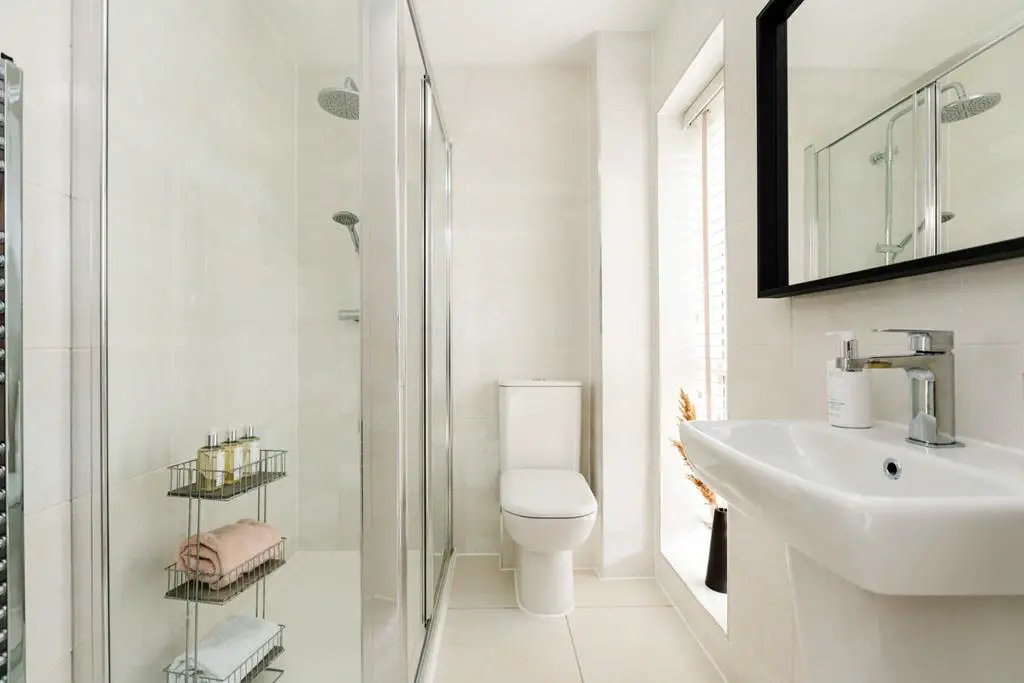 The en suite features a double shower
