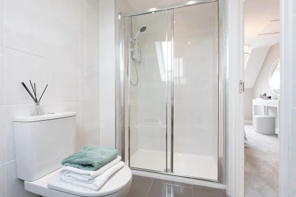 The en suite features a large double shower