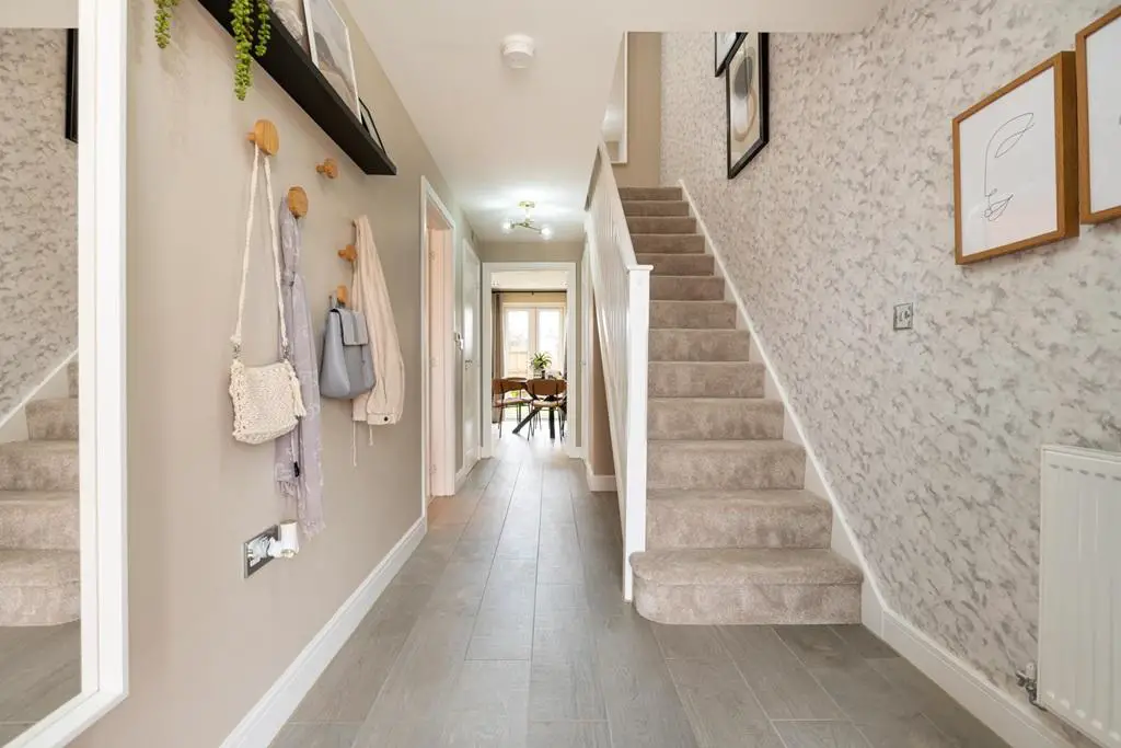Welcoming entrance hall with under stairs storage