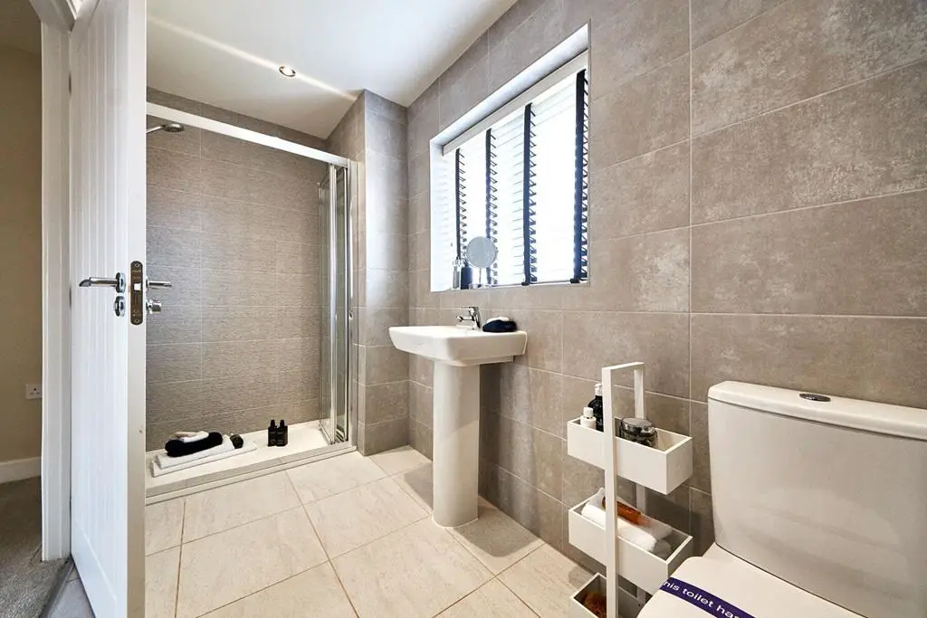 The main bedroom boasts its own en suite shower...