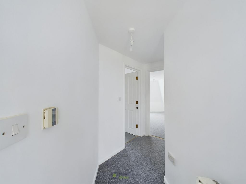 Hallway leading to kitchen/living area and bedroom