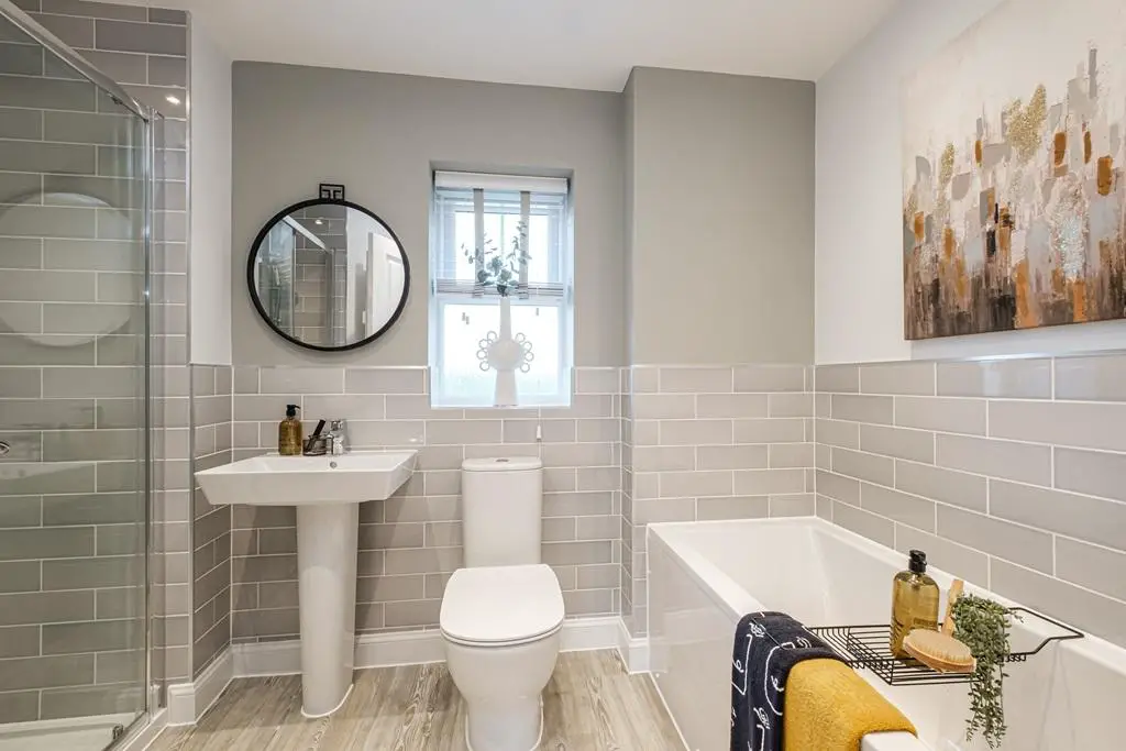 Grey tiled bathroom in an Exeter home