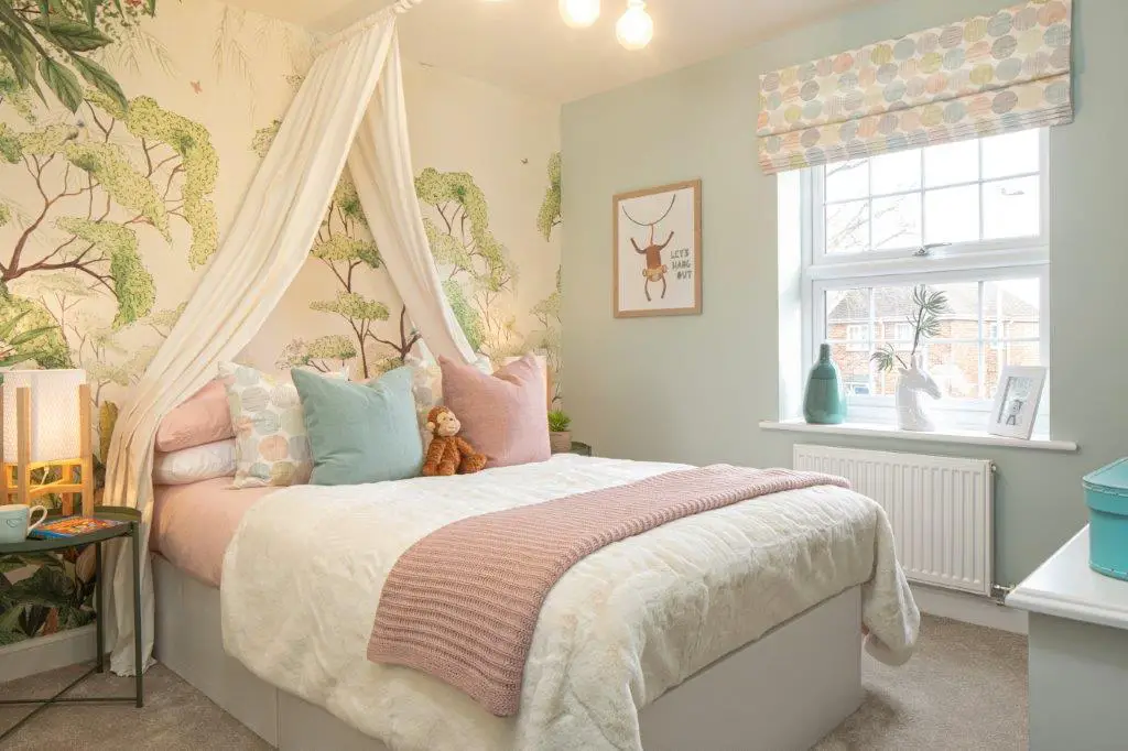 Pastel themed child&#39;s bedroom with canopy