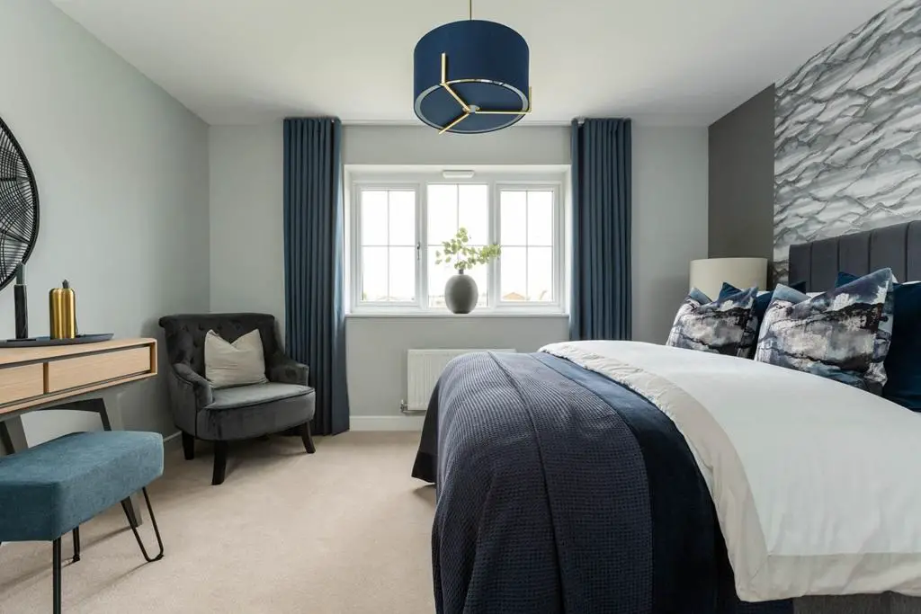 Relax in the spacious en suite bedroom with...
