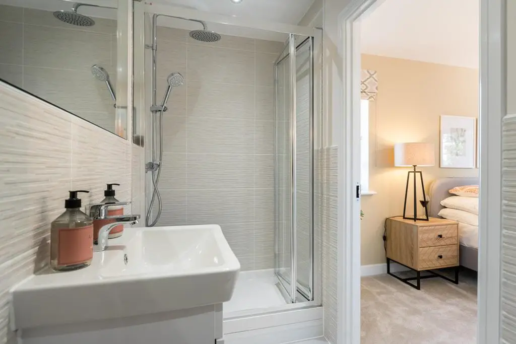 The en suite benefits from a double shower