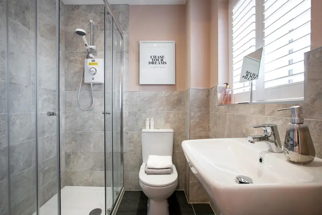 A well proportioned en suite sits off the main...