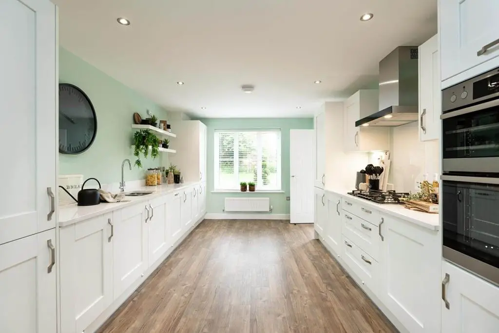 The large modern kitchen offers plenty of...