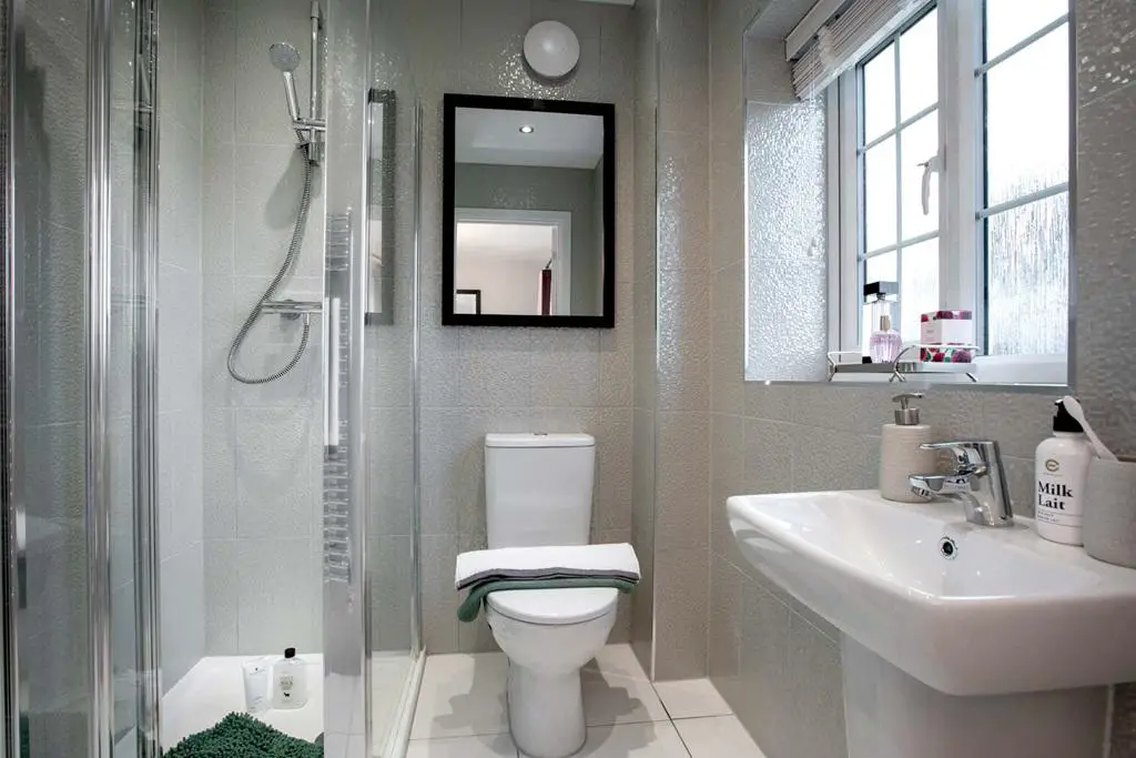 The en suite is spacious and features a shower