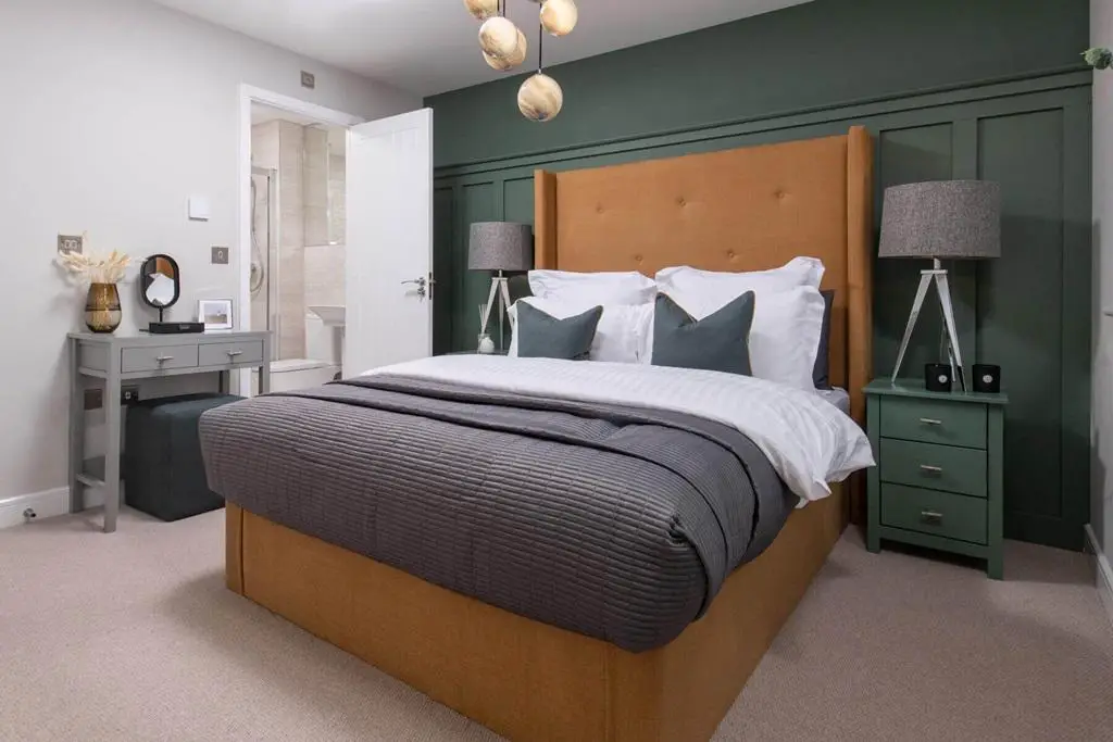 Bedroom 1 hosts a private en suite, creating a...