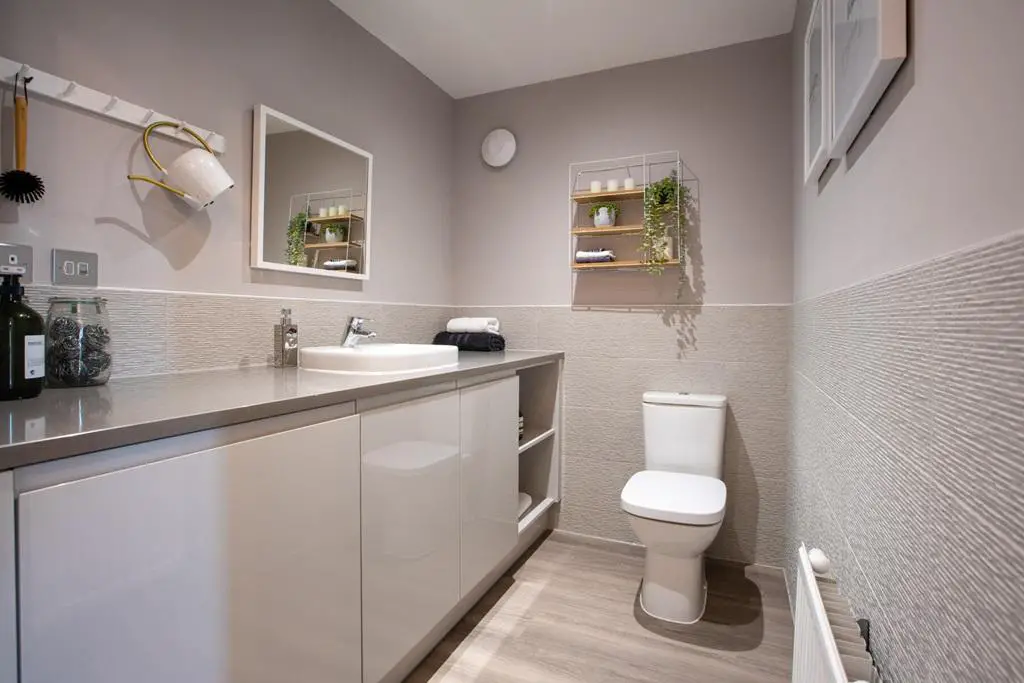 Handy cloakroom and utility room with laundry...