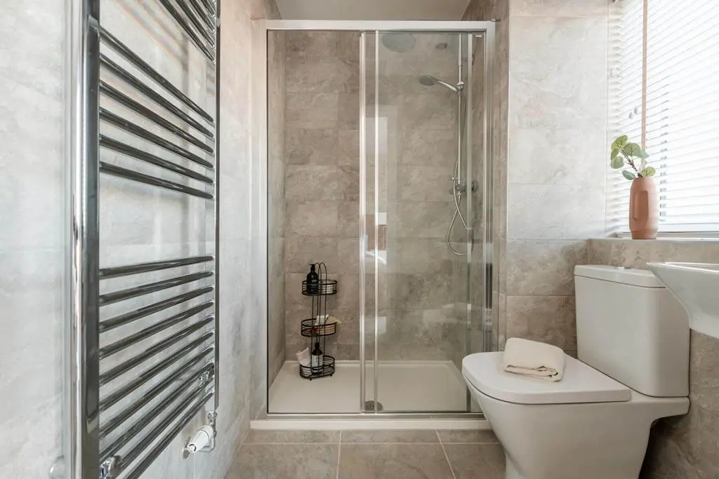Bedroom also hosts a private en suite shower room