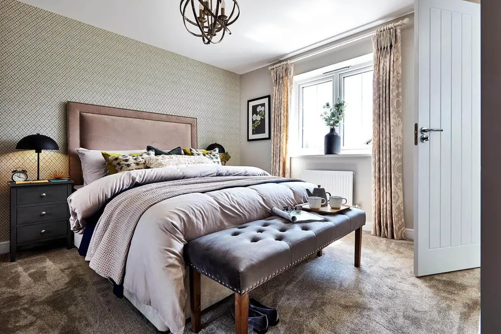 The main bedroom offers a quiet space away from...