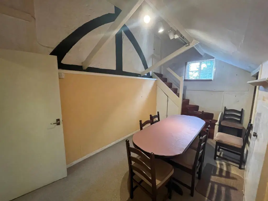 Dining room with exposed beams