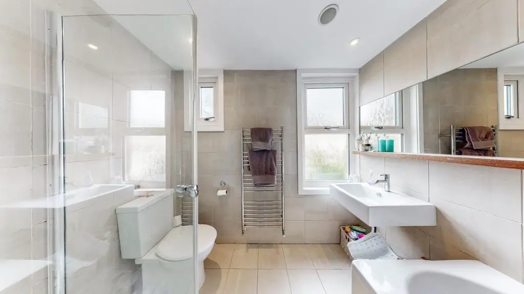 Modern family bathroom with bath &amp; shower cubical