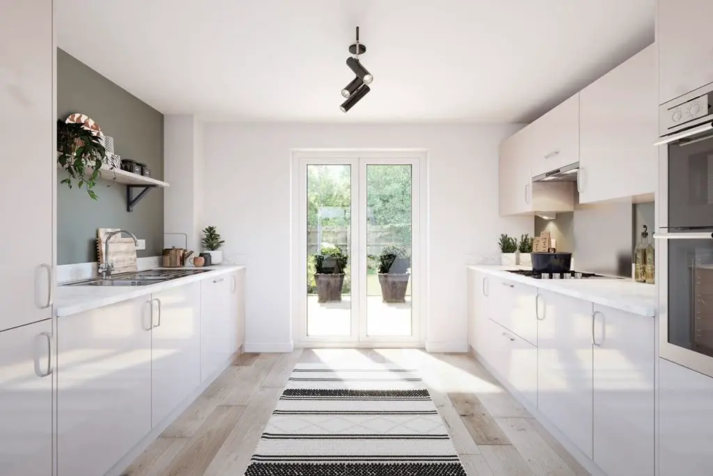 A bright and modern kitchen with ample storage...