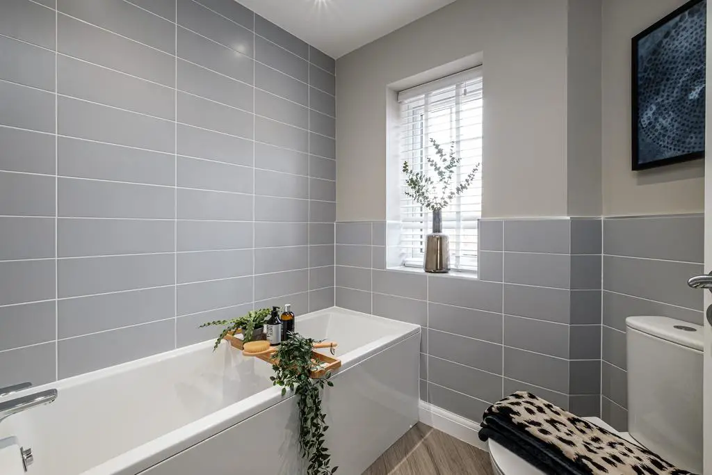 Bathroom with grey tiles