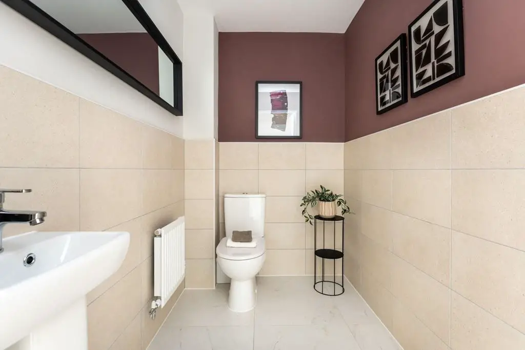 A downstairs toilet sits in the middle of the home