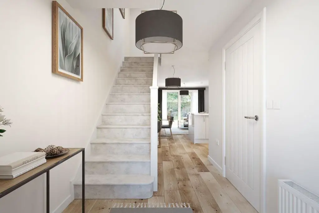 A welcoming hallway leading to the open plan...