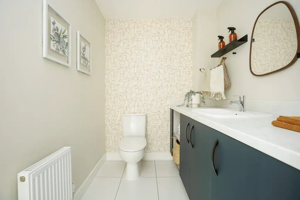 The cloakroom doubles as a utility room
