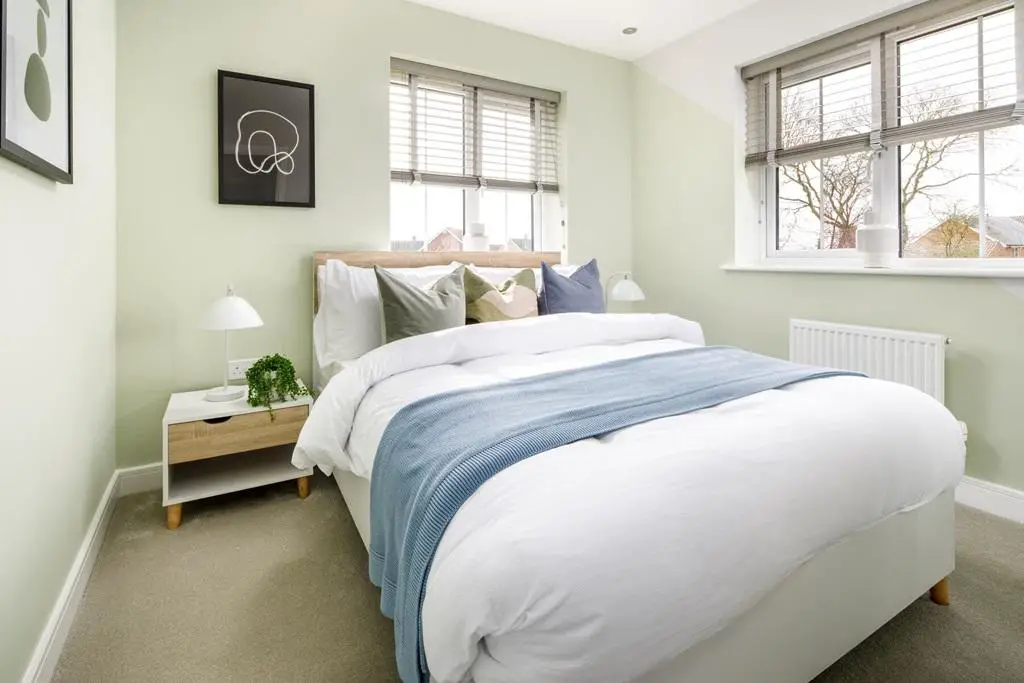 Bedroom 2 is an ideal guest bedroom, with space...