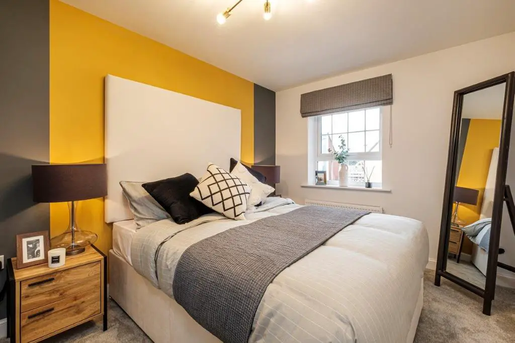 Double bedroom with yellow painted wall