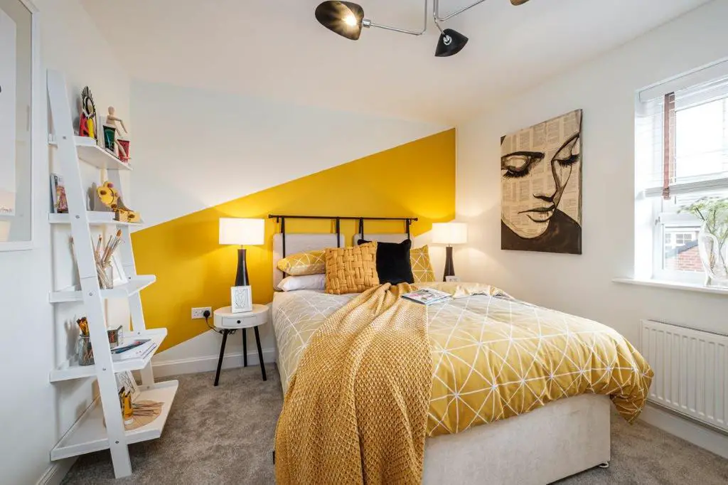 Photo of a double bedroom with yellow decor