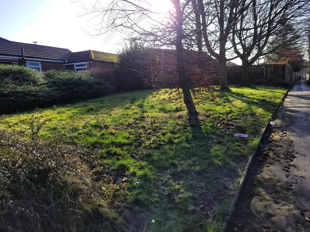 Freehold land in Preston with trees and footpath o