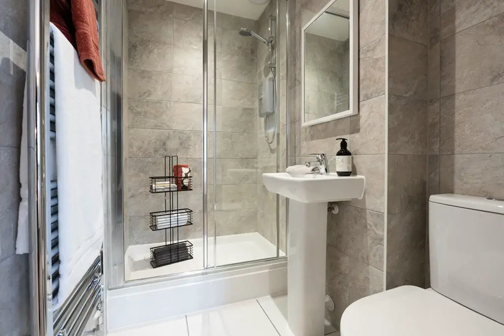 An en suite shower room away from the family