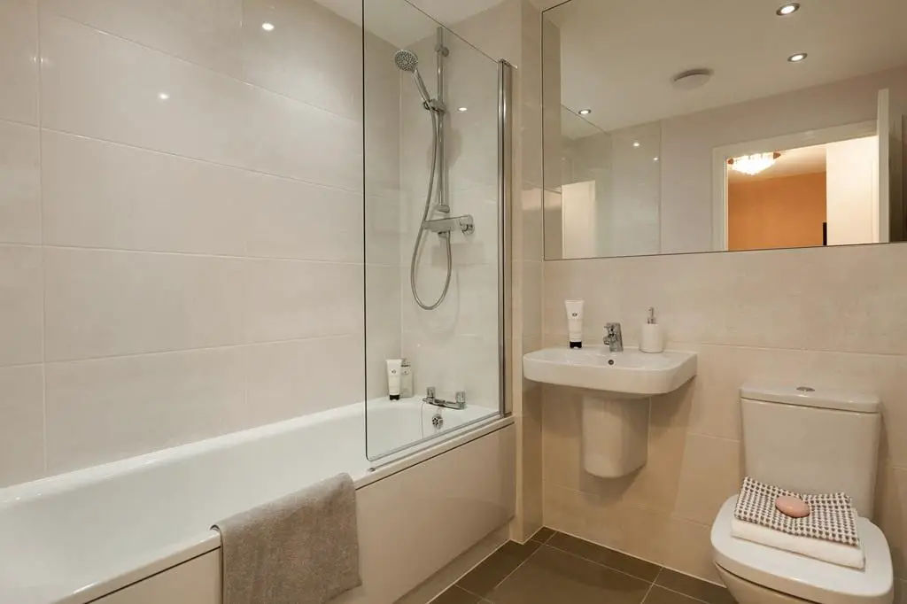 A main bathroom with high quality fixtures and...
