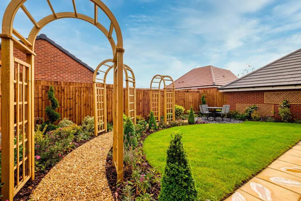 Photo of a landscaped garden with pathway and turf