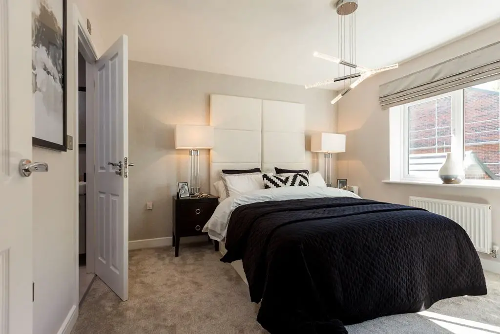 A spacious main bedroom with storage space