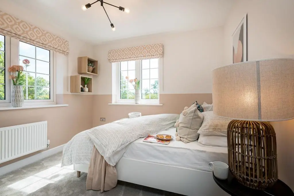 Natural light floods this airy second bedroom