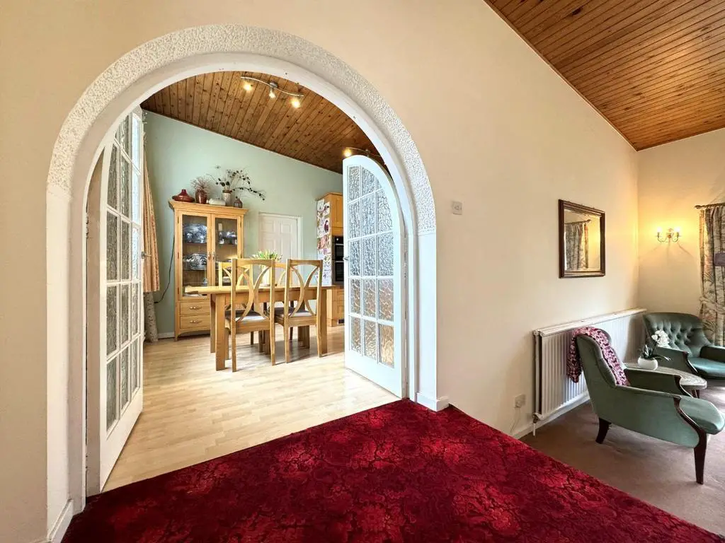 Arched doors into the kitchen