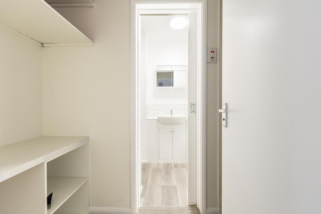 Entrance to shower room − storage area