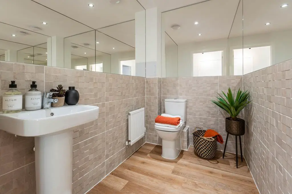 The ground floor features a convenient cloakroom