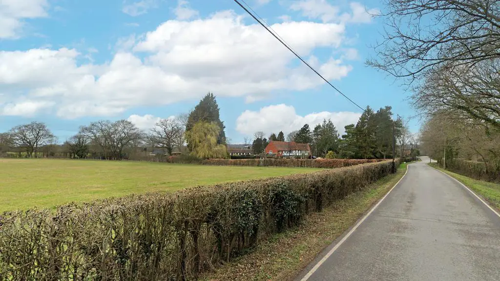 Land for sale on an affluent road.