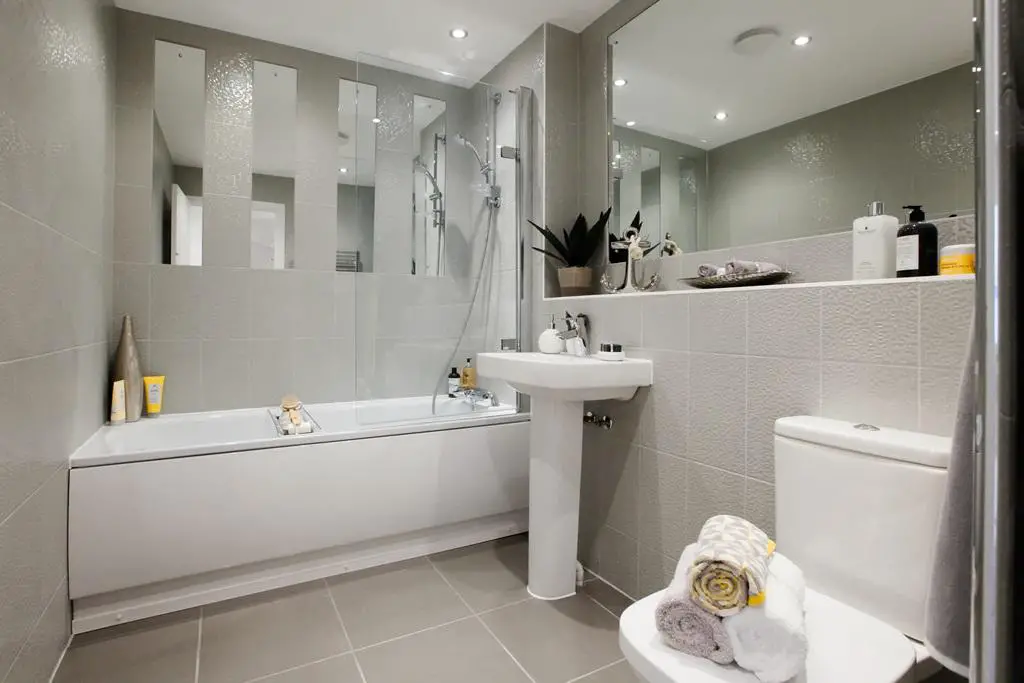 Full height tiling and mirrors included in the...