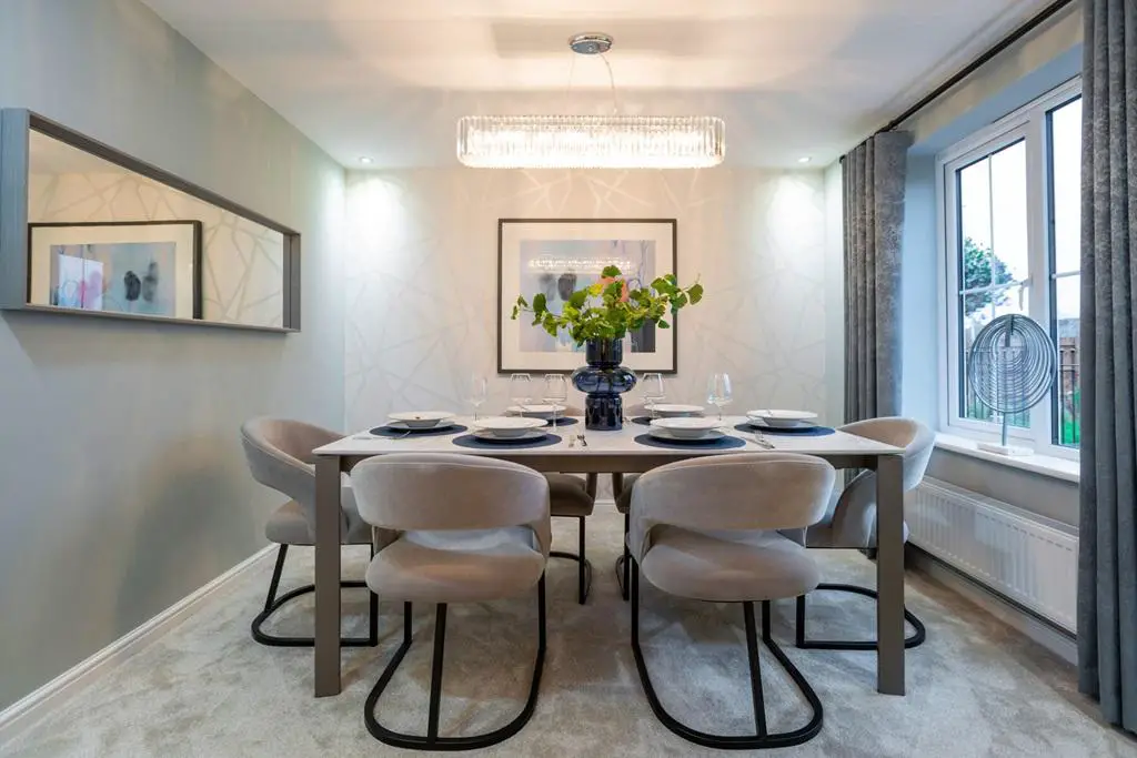 The dining room space could also be used for an...