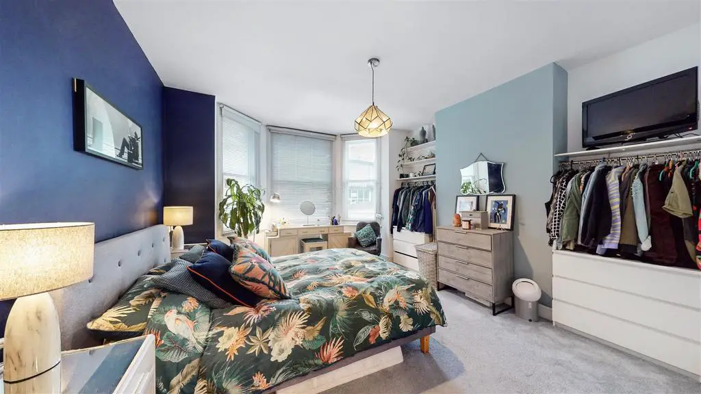 High ceilings in double bedroom into bay window