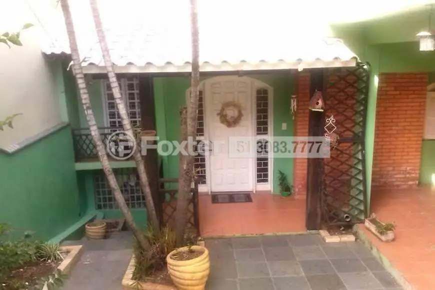 Foto 1 de Casa com 3 Quartos à venda, 264m² em Santa Fé, Porto Alegre