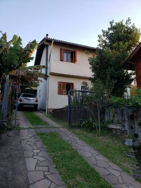 Foto 4 de Casa com 5 Quartos à venda, 300m² em Vila Nova, Porto Alegre