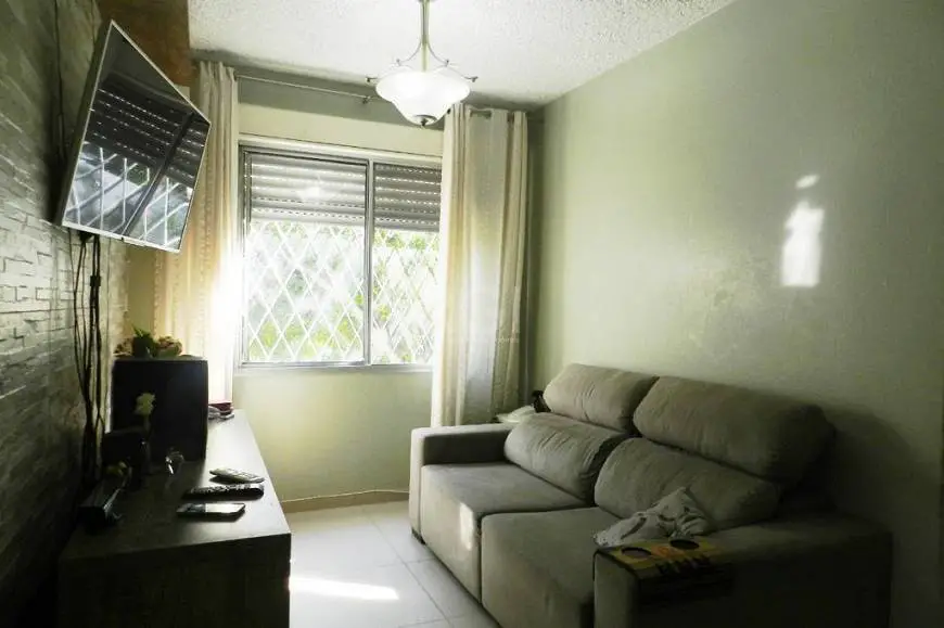 Foto 2 de Apartamento com 3 Quartos à venda, 66m² em Vila Nova, Porto Alegre