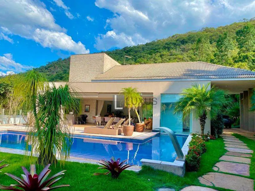 Foto 1 de Casa de Condomínio com 4 Quartos para venda ou aluguel, 657m² em Condominio Quintas do Sol, Nova Lima